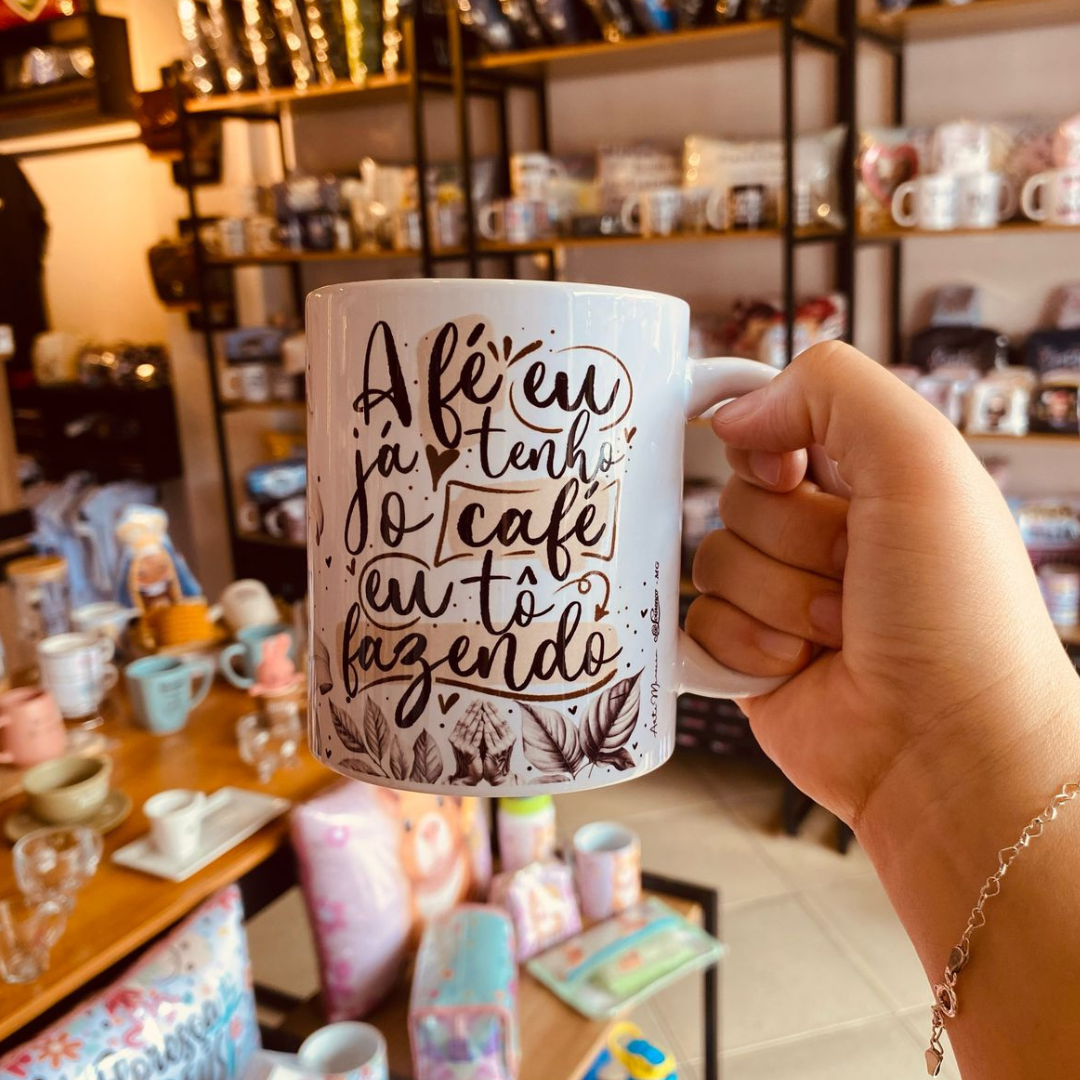 Caneca “A fé eu já tenho, o café eu tô fazendo” Caneca “A fé eu já tenho, o café eu tô fazendo”